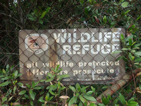 old sign of wildlife refuge