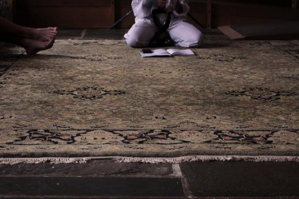 people sitting on carpet